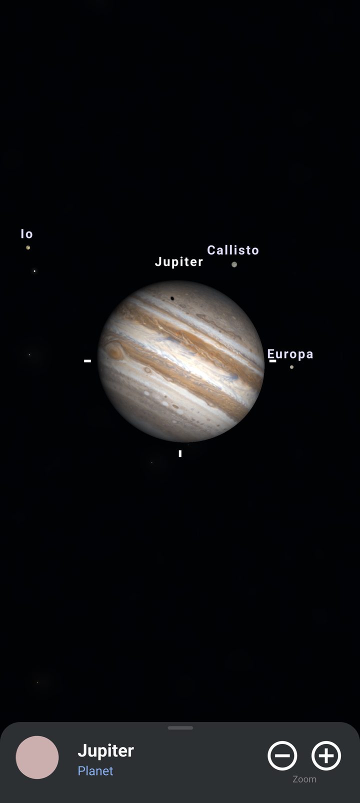 Jupiter with Io, Europa and Callisto, and a moon's shadow on the clouds